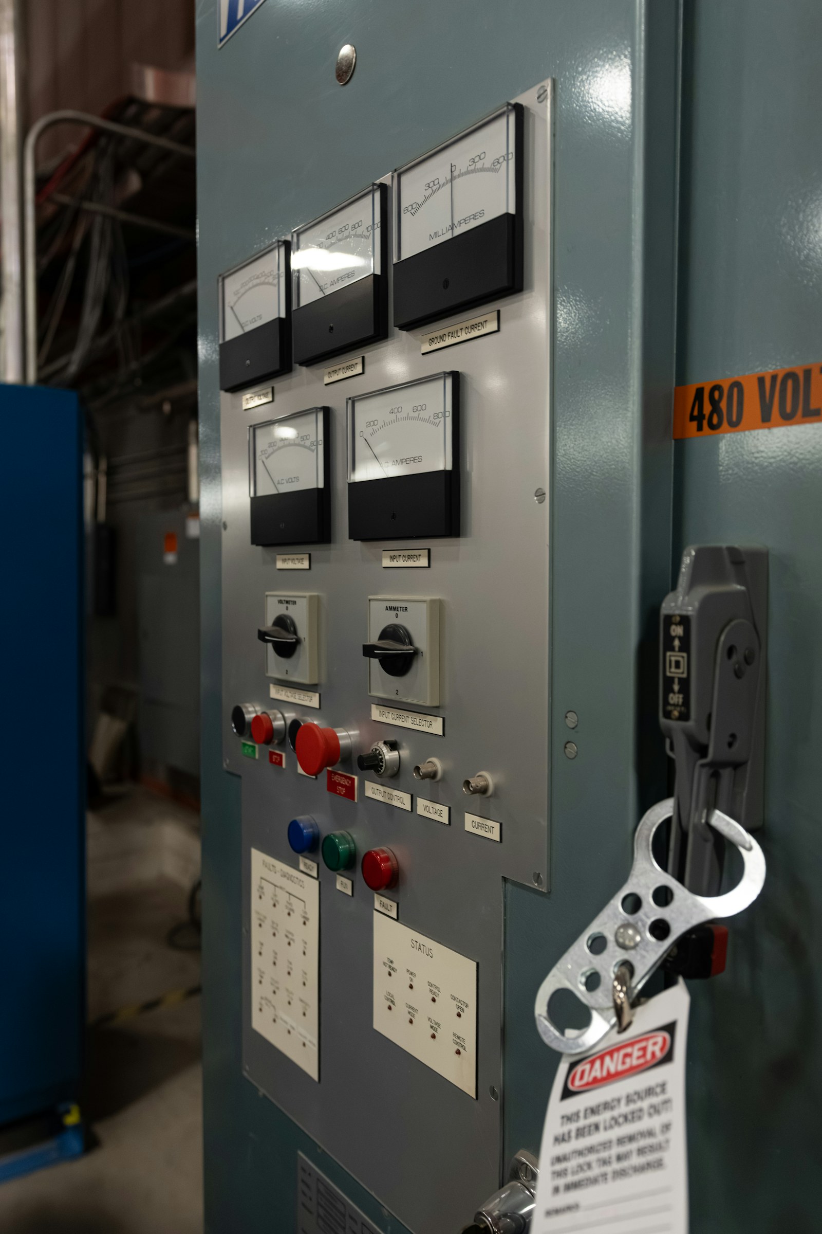 Industrial electrical control panel with analog gauges, switches and safety lockout